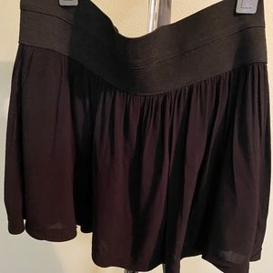 Black pleated miniskirt